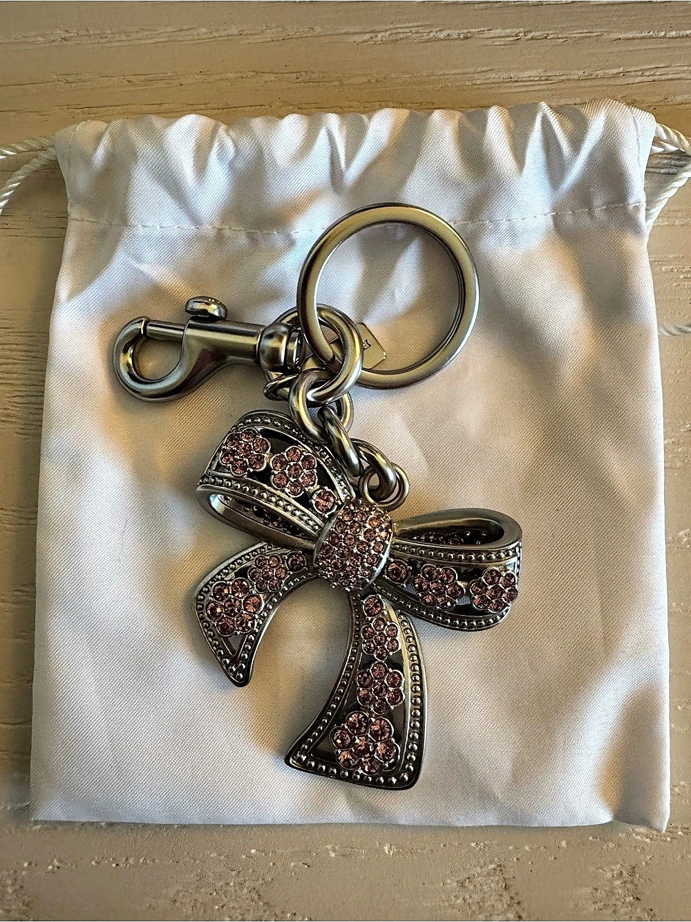 Coach Bow Bag Charm Rhinestone Bow in Silver & Pink